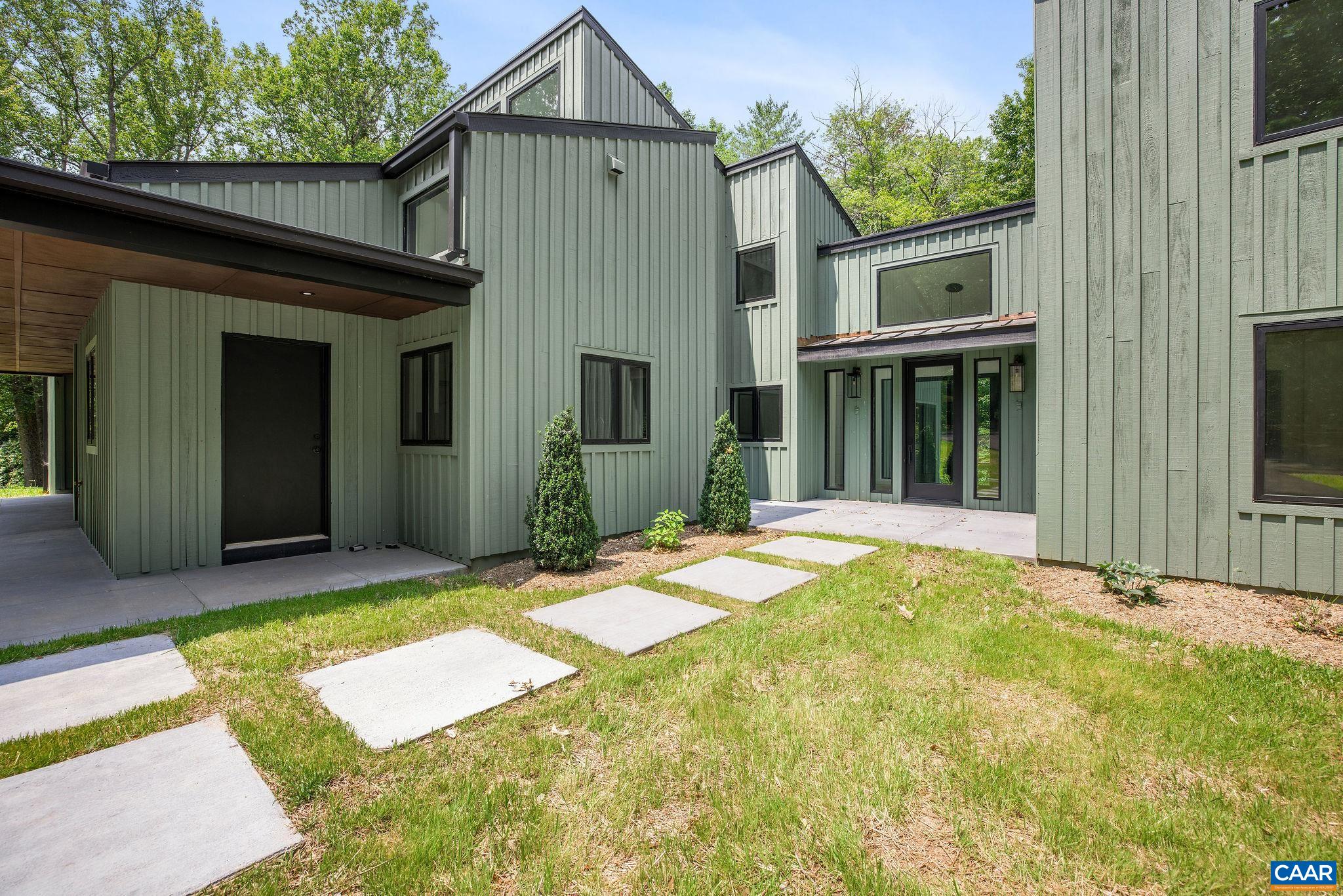2482 Schelford Farm Road Charlottesville, VA 22901 - Photo 20 of 39 a front view of a house with a yard and garage