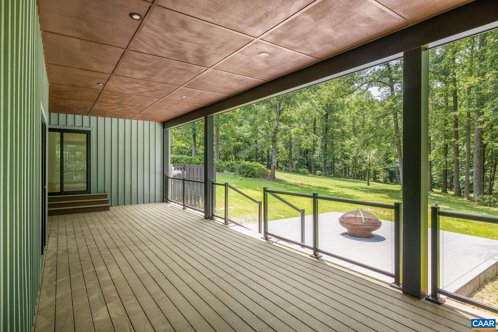 2482 Schelford Farm Road Charlottesville, VA 22901 - Photo 24 of 39 a view of empty room with wooden floor and floor to ceiling windows