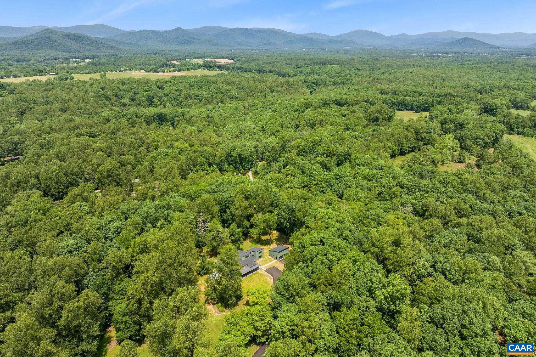2482 Schelford Farm Road Charlottesville, VA 22901 - Photo 26 of 39 a view of a lush green hillside and houses