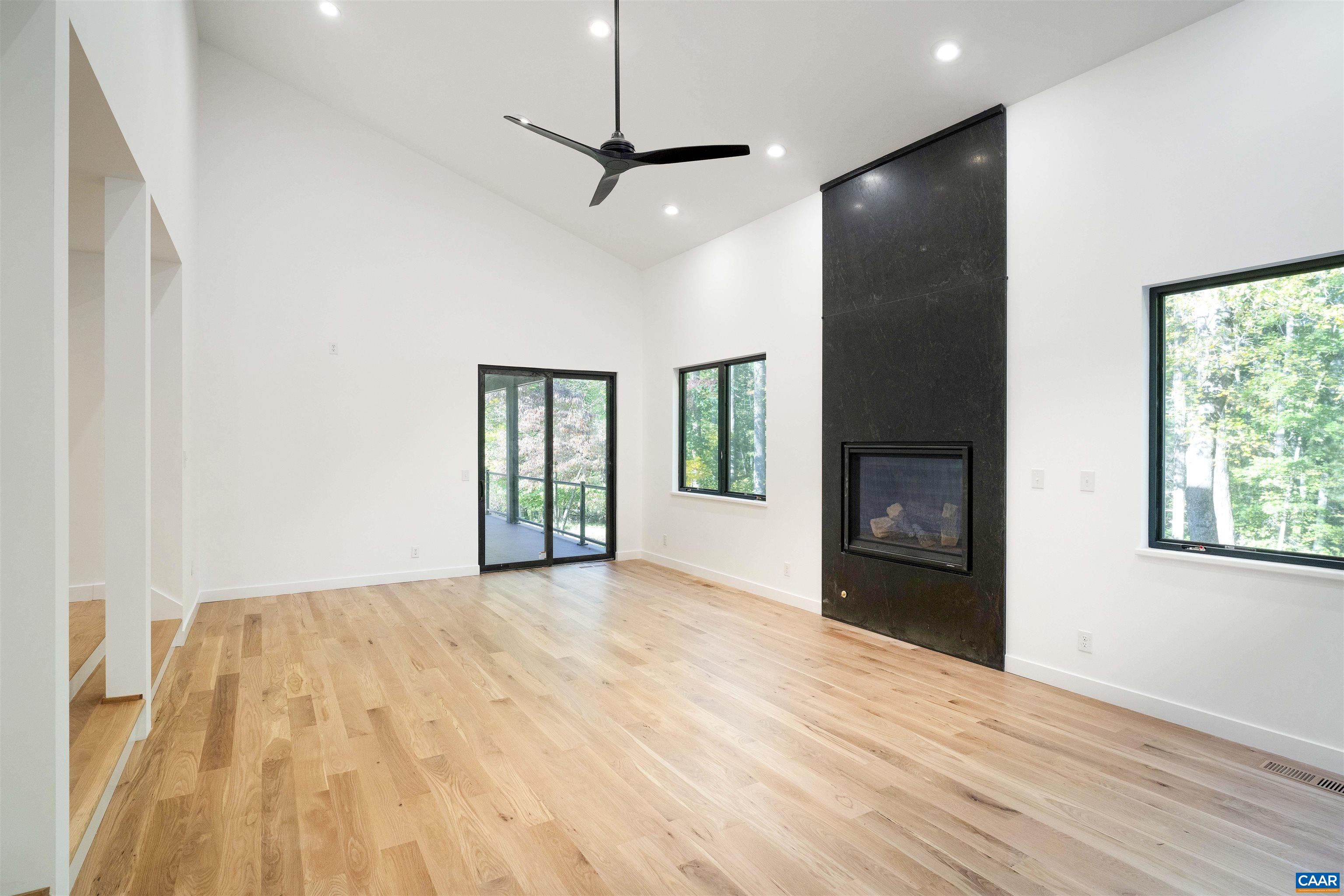 2482 Schelford Farm Road Charlottesville, VA 22901 - Photo 3 of 39 a view of empty room with wooden floor and fan