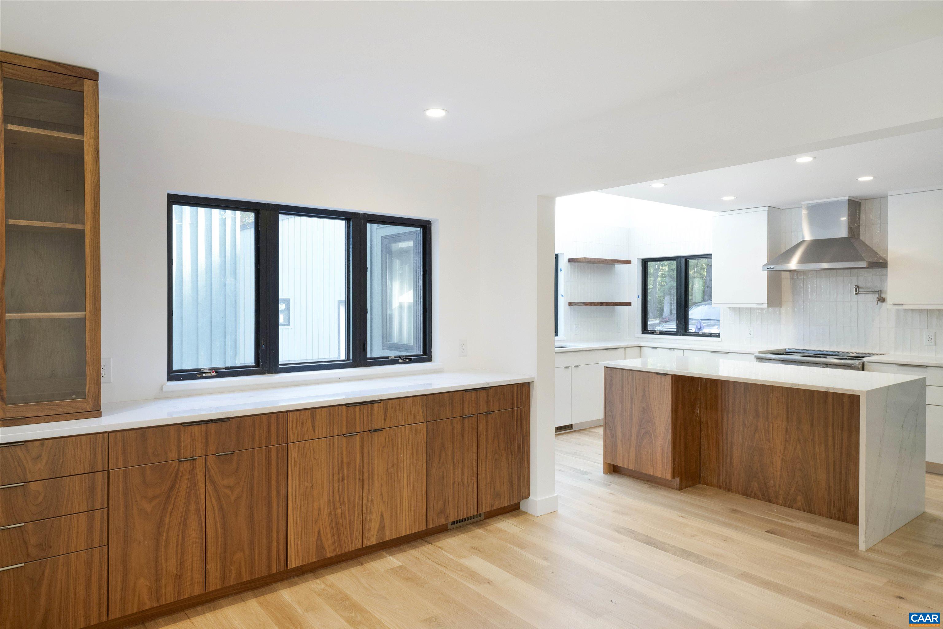 2482 Schelford Farm Road Charlottesville, VA 22901 - Photo 8 of 39 a large kitchen with stainless steel appliances granite countertop a stove and a sink