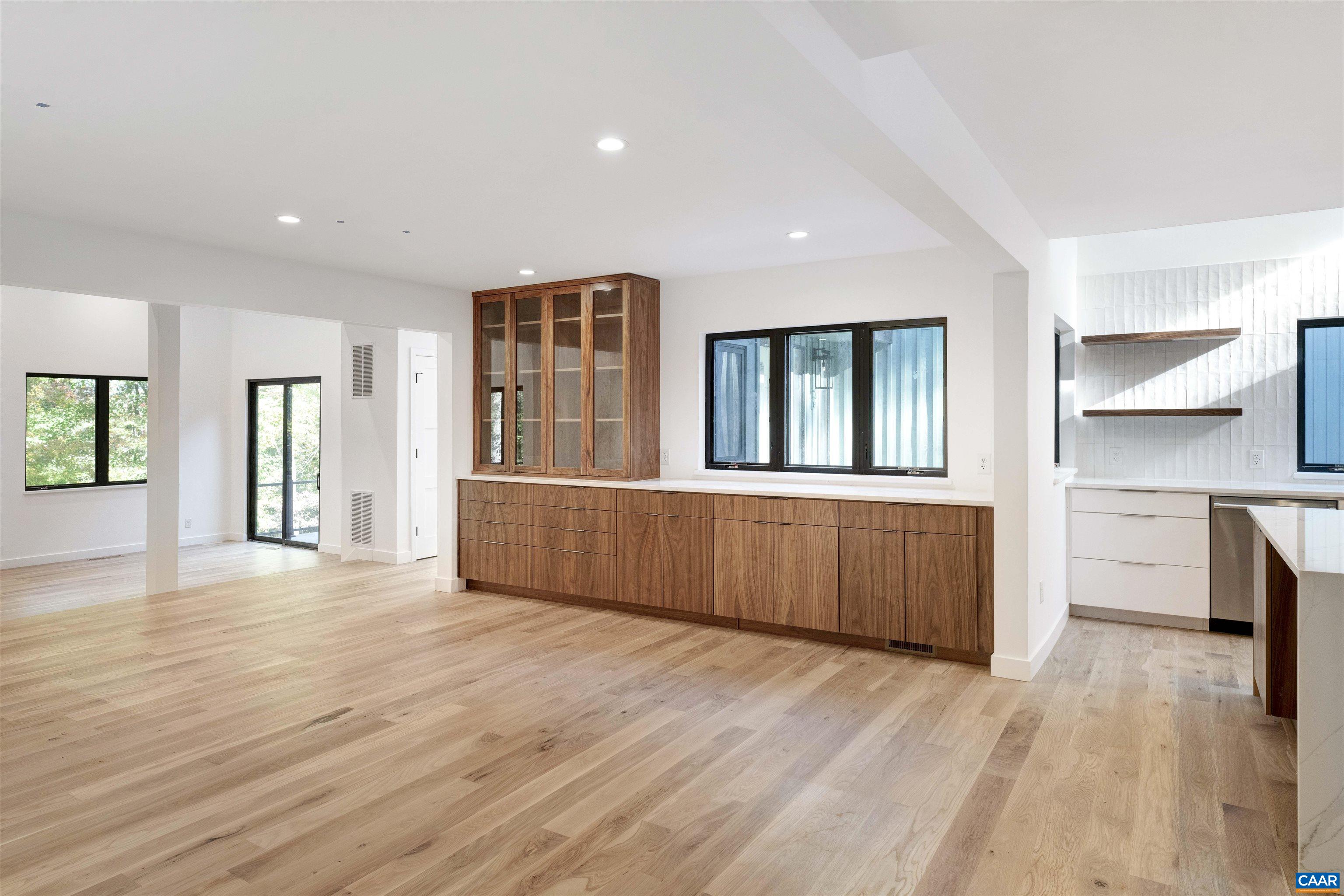 2482 Schelford Farm Road Charlottesville, VA 22901 - Photo 9 of 39 a view of an empty room with a window and wooden floor