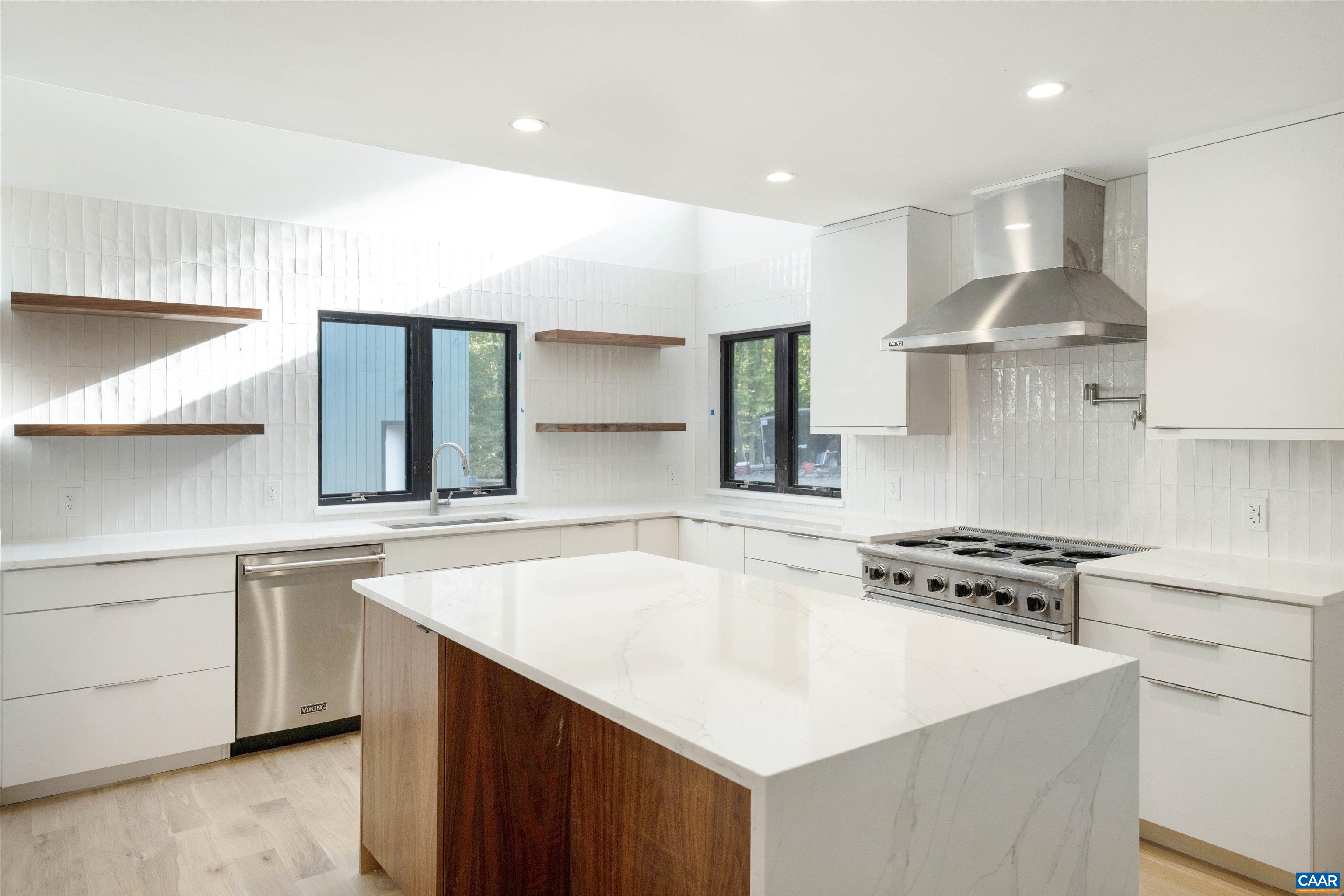 2482 Schelford Farm Road Charlottesville, VA 22901 - Photo 10 of 39 a kitchen with stainless steel appliances a sink a stove a refrigerator and cabinets