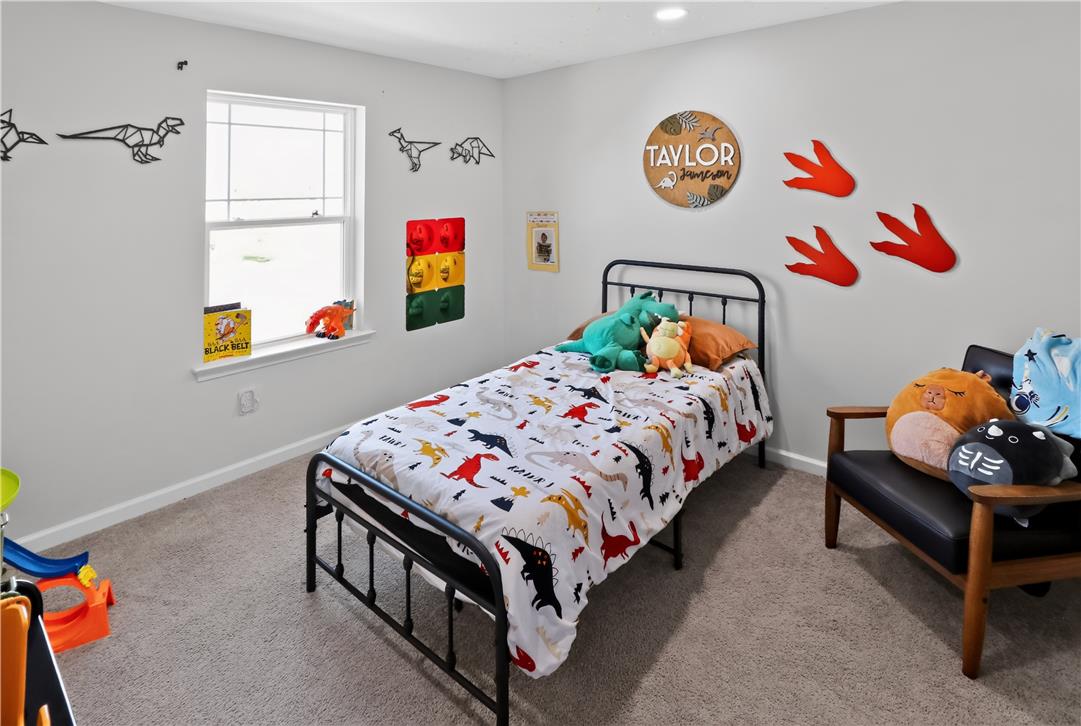 4502 Benjamin Court Emmaus, PA 18049 - Photo 35 of 48 A well-lit bedroom features plush carpeting and a large window providing ample natural light.