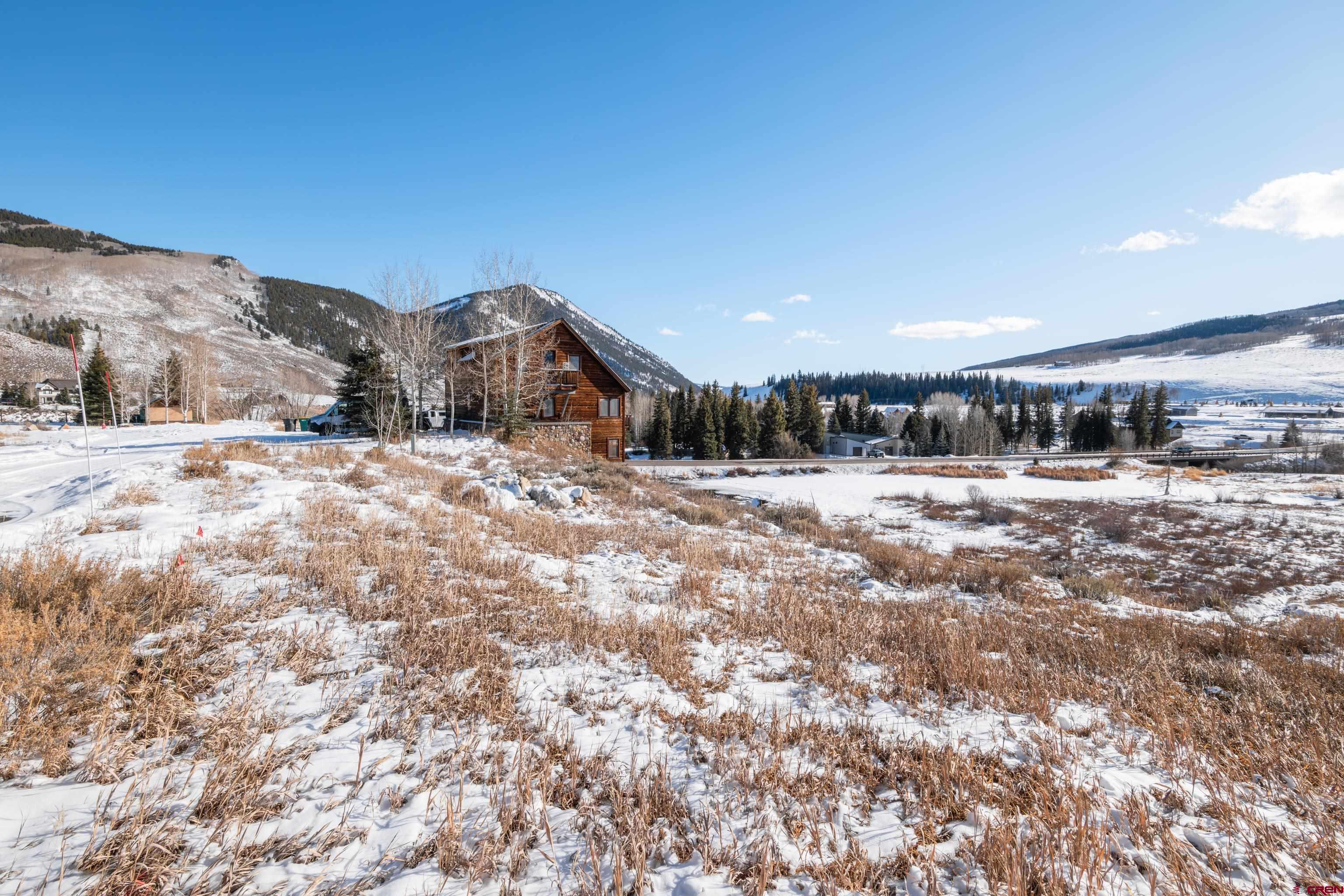 45 Cascadilla Street Crested Butte, CO 81224 - Photo 24 of 25 a view of a large body of water with a building in the background