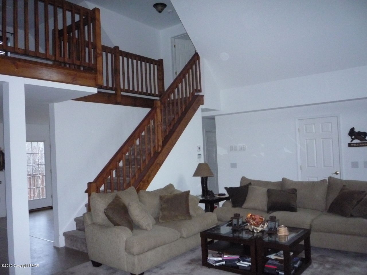 85 Buck Hill Road Blakeslee, PA 18610 - Photo 24 of 36 Living room with stairs
