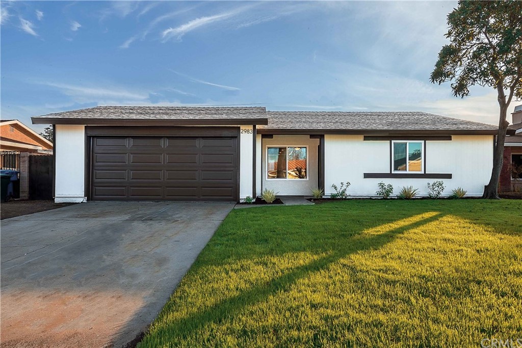 2983 Spruce Street West Rialto, CA 92376 - Photo 1 of 1 a front view of house with yard