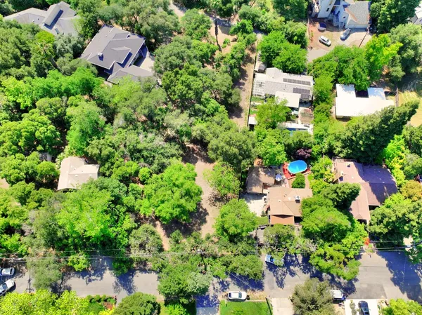 an aerial view of a house with a yard and garden