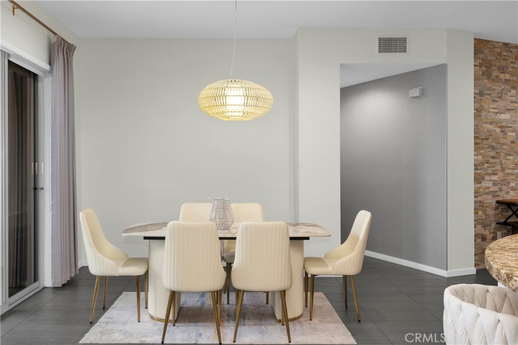 21 Gramercy, Unit 220 Irvine, CA 92612 - Photo 4 of 36 a view of a dining room with furniture and a window