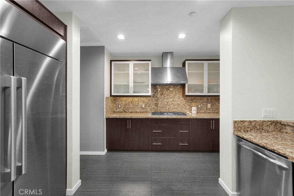 21 Gramercy, Unit 220 Irvine, CA 92612 - Photo 7 of 36 a view of kitchen with stainless steel appliances granite countertop refrigerator and sink