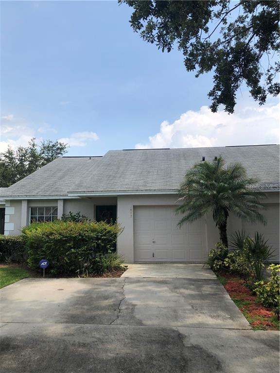 1072 Meadowood Pointe Road Lakeland, FL 33811 - Photo 1 of 1 a front view of a house with a garden