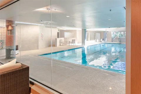 a bathroom with a glass shower door