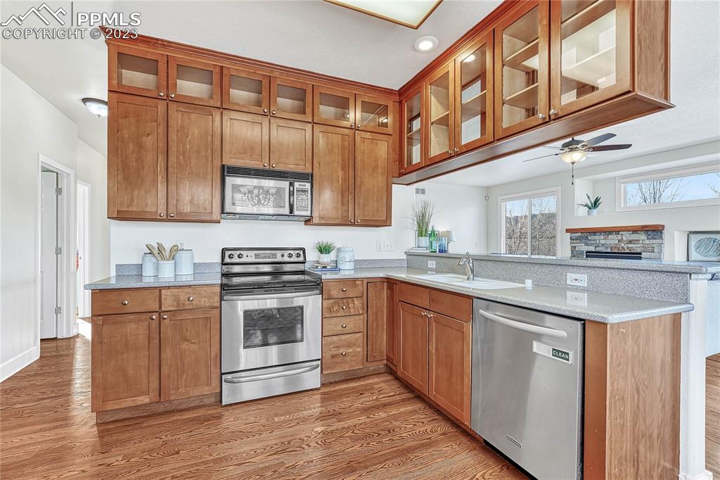 16946 Buffalo Valley Path Monument, CO 80132 - Photo 12 of 41 a kitchen with stainless steel appliances granite countertop a stove and a sink