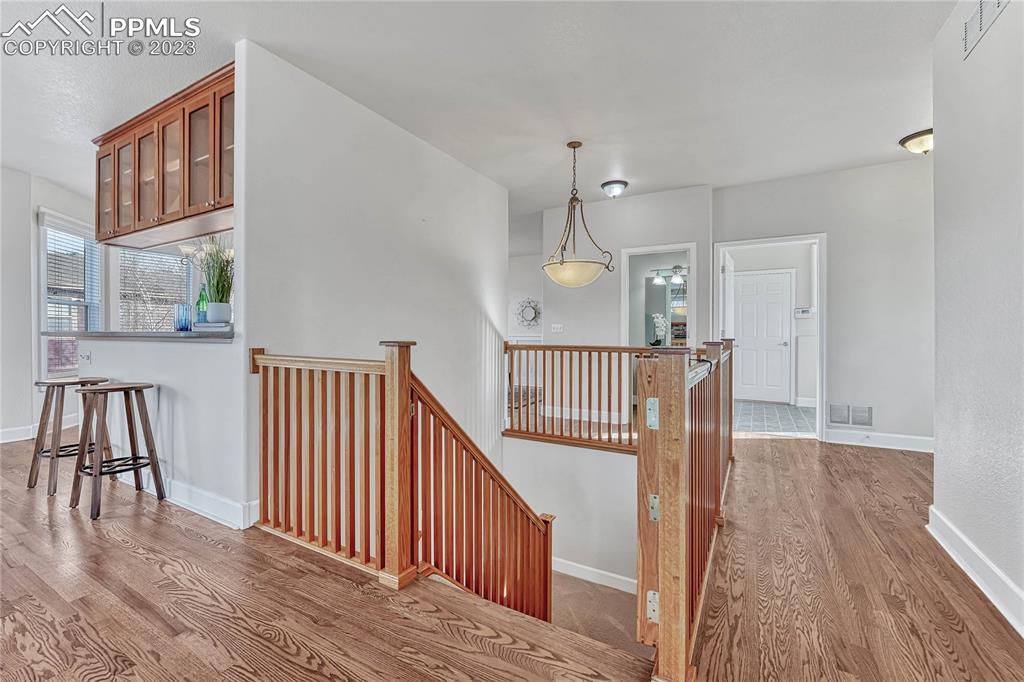 16946 Buffalo Valley Path Monument, CO 80132 - Photo 22 of 41 a view of staircase and wooden floor