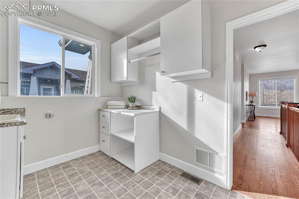 16946 Buffalo Valley Path Monument, CO 80132 - Photo 25 of 41 a view of a kitchen with furniture and wooden floor