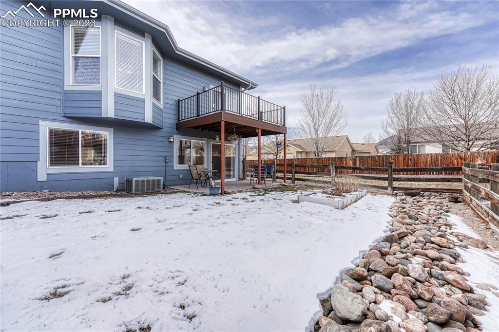 16946 Buffalo Valley Path Monument, CO 80132 - Photo 29 of 41 a view of a house with a yard covered in snow