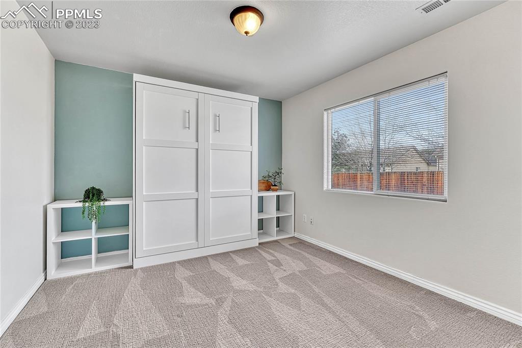 16946 Buffalo Valley Path Monument, CO 80132 - Photo 32 of 41 an empty room with windows
