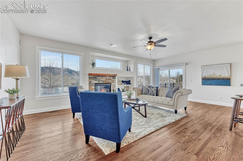 16946 Buffalo Valley Path Monument, CO 80132 - Photo 5 of 41 a living room with furniture and a fireplace