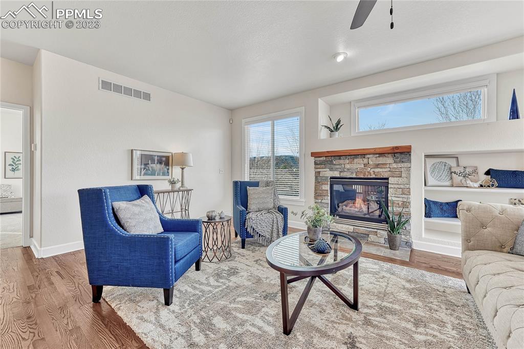 16946 Buffalo Valley Path Monument, CO 80132 - Photo 6 of 41 a living room with furniture and a fireplace