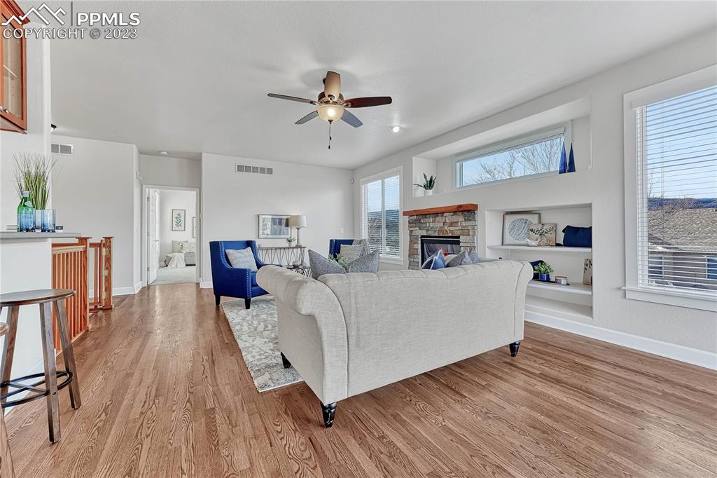 16946 Buffalo Valley Path Monument, CO 80132 - Photo 7 of 41 a living room with furniture and a wooden floor