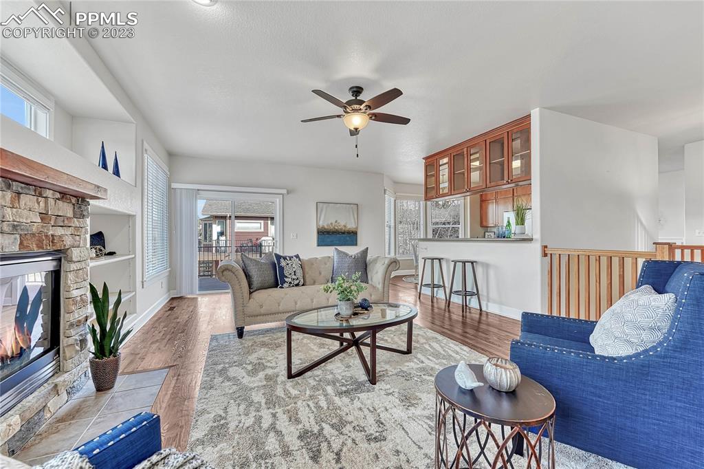 16946 Buffalo Valley Path Monument, CO 80132 - Photo 8 of 41 a living room with furniture and a fireplace