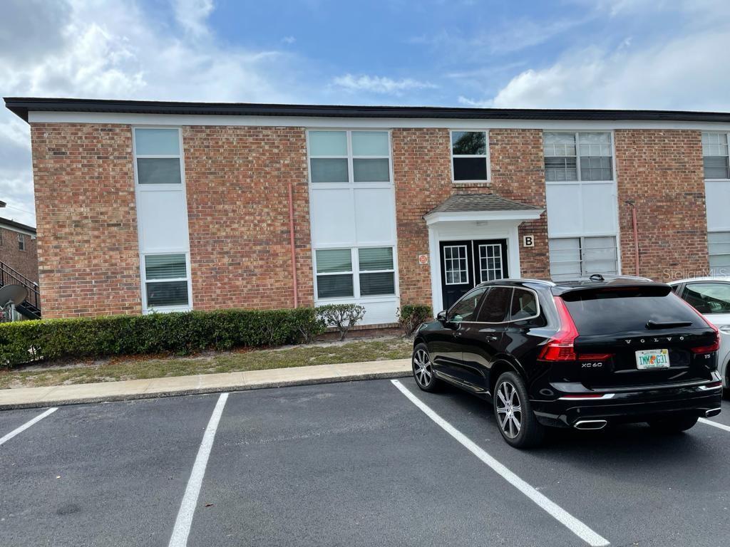 5325 Curry Ford Road, Unit B101 Orlando, FL 32812 - Photo 1 of 22 a car parked in front of a house