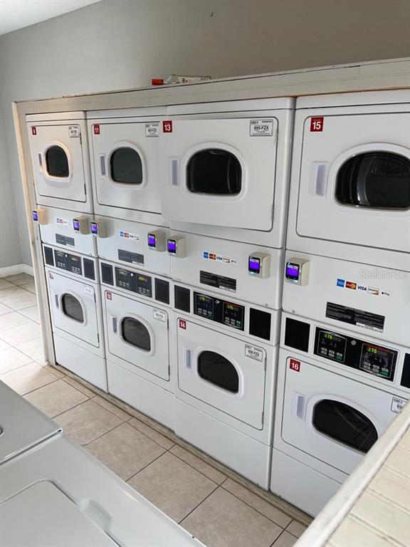 5325 Curry Ford Road, Unit B101 Orlando, FL 32812 - Photo 20 of 22 a utility room with dryer and washer