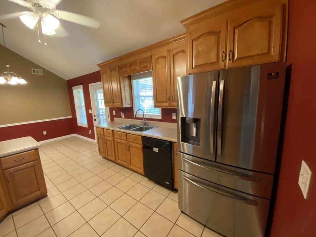 277 Harper Lane Royston, GA 30662 - Photo 17 of 42 a kitchen with stainless steel appliances a refrigerator sink and cabinets