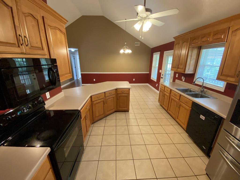 277 Harper Lane Royston, GA 30662 - Photo 18 of 42 a kitchen with stainless steel appliances granite countertop a sink and a stove