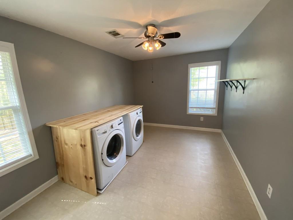277 Harper Lane Royston, GA 30662 - Photo 21 of 42 a view of a kitchen with a stove cabinets and a window
