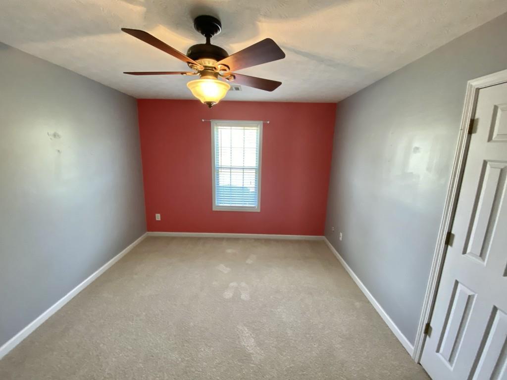 277 Harper Lane Royston, GA 30662 - Photo 24 of 42 an empty room with windows and fan