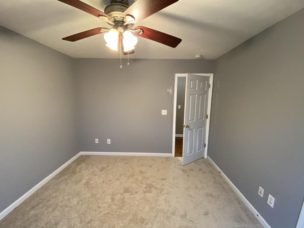 277 Harper Lane Royston, GA 30662 - Photo 27 of 42 an empty room with a fan and a fan