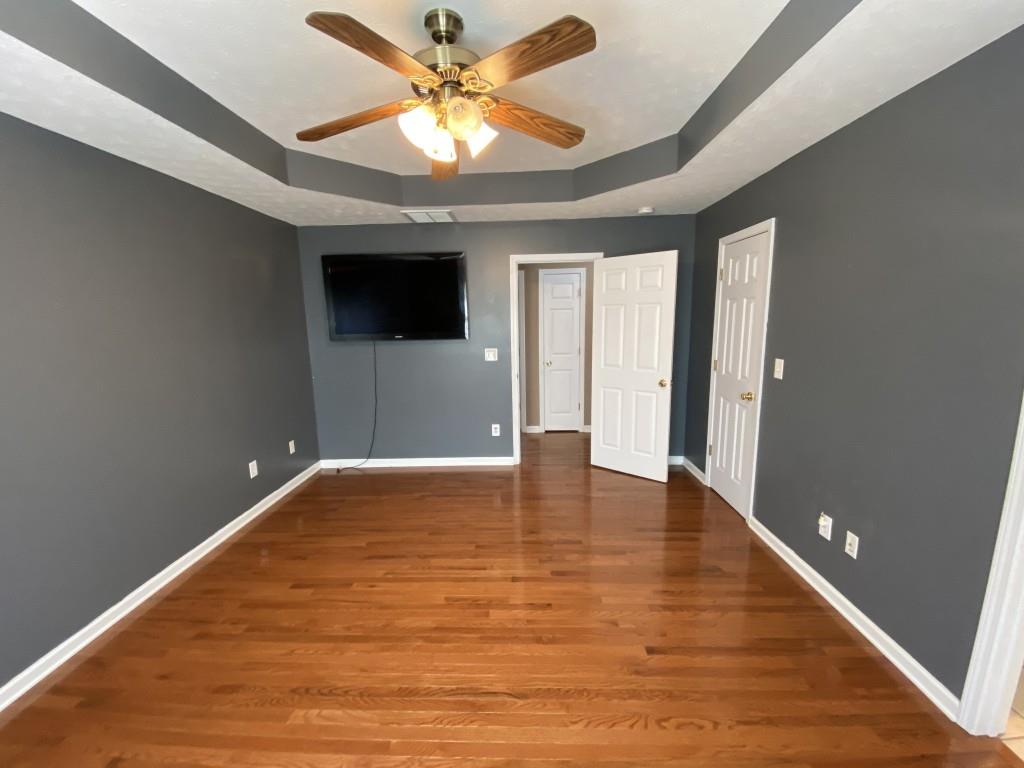277 Harper Lane Royston, GA 30662 - Photo 30 of 42 wooden floor in an empty room with a window