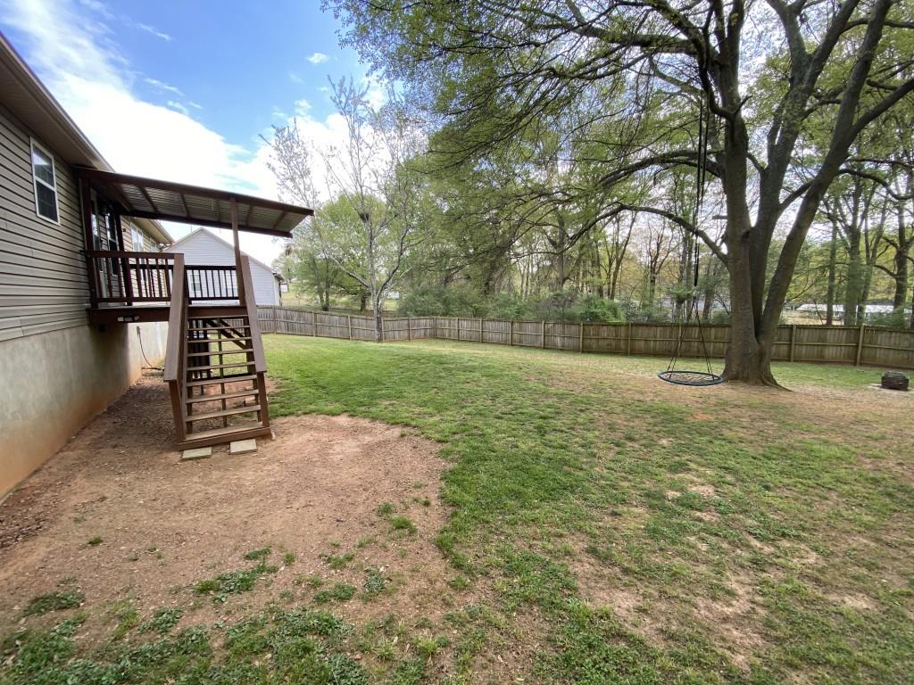 277 Harper Lane Royston, GA 30662 - Photo 37 of 42 a view of a yard with a slide