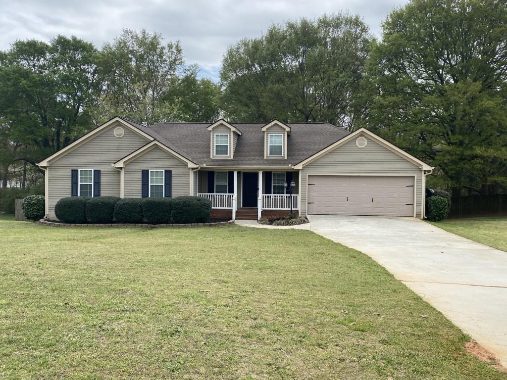 277 Harper Lane Royston, GA 30662 - Photo 42 of 42 a front view of a house with a garden