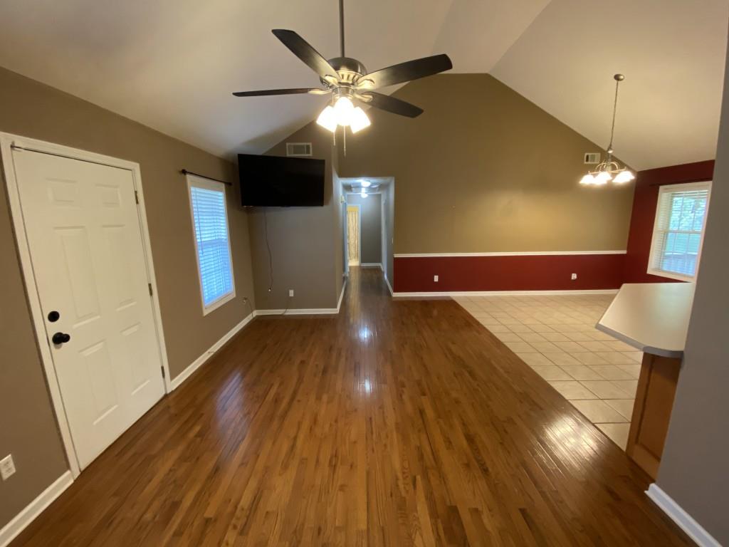 277 Harper Lane Royston, GA 30662 - Photo 8 of 42 a view of a hallway with wooden floor