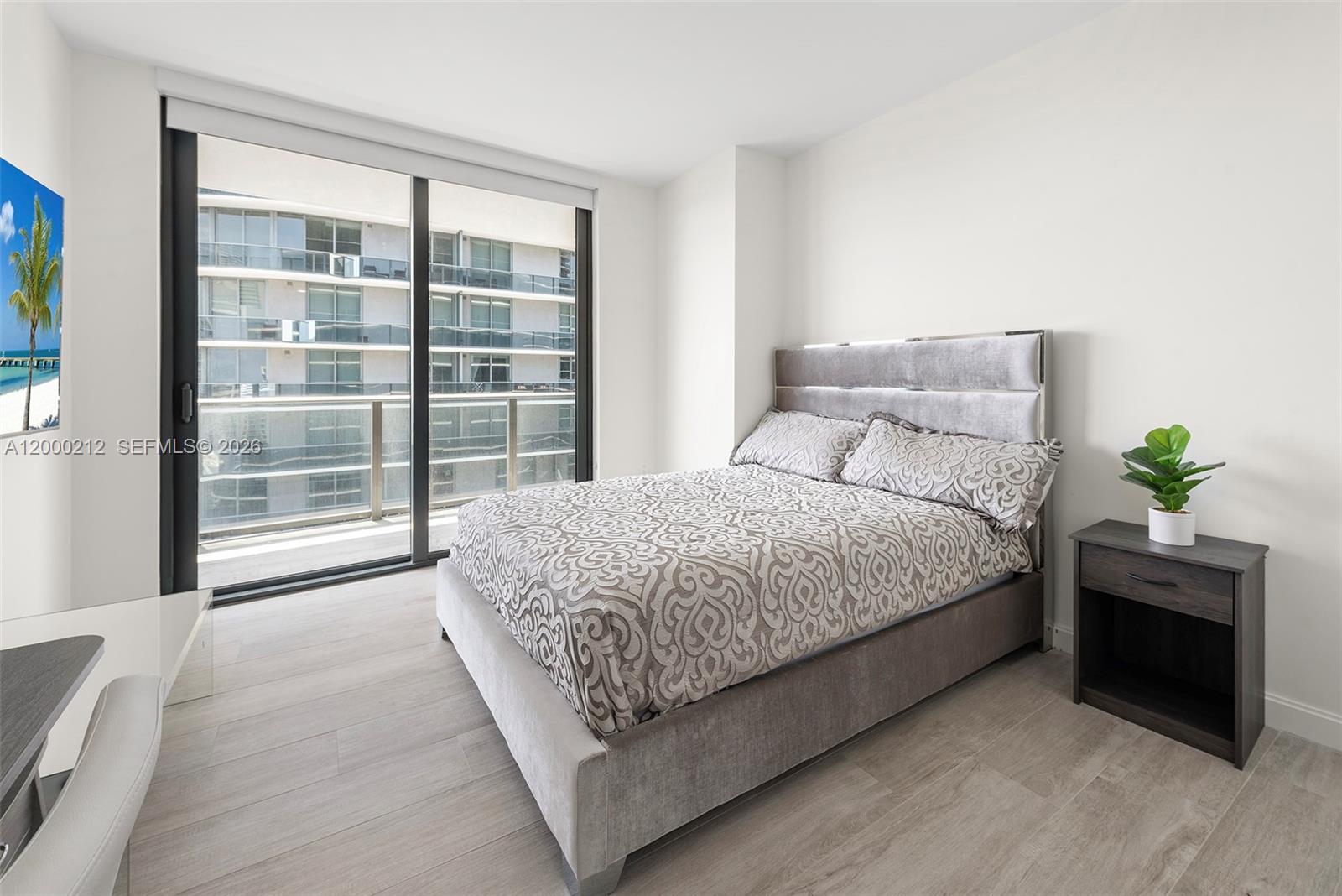 45 Southwest 9th Street, Unit 4006 Miami, FL 33130 - Photo 13 of 62 a bedroom with a bed and a window