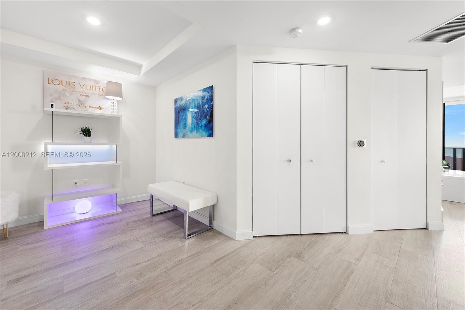 45 Southwest 9th Street, Unit 4006 Miami, FL 33130 - Photo 16 of 62 a view of a room with wooden floor and cabinet
