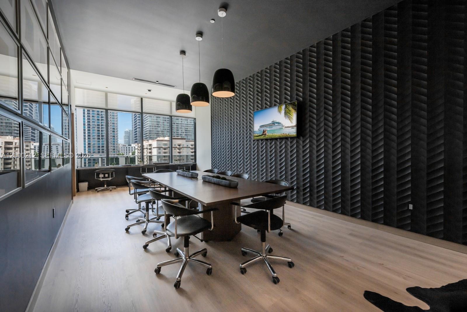 45 Southwest 9th Street, Unit 4006 Miami, FL 33130 - Photo 47 of 62 a view of a workspace with furniture and wooden floor