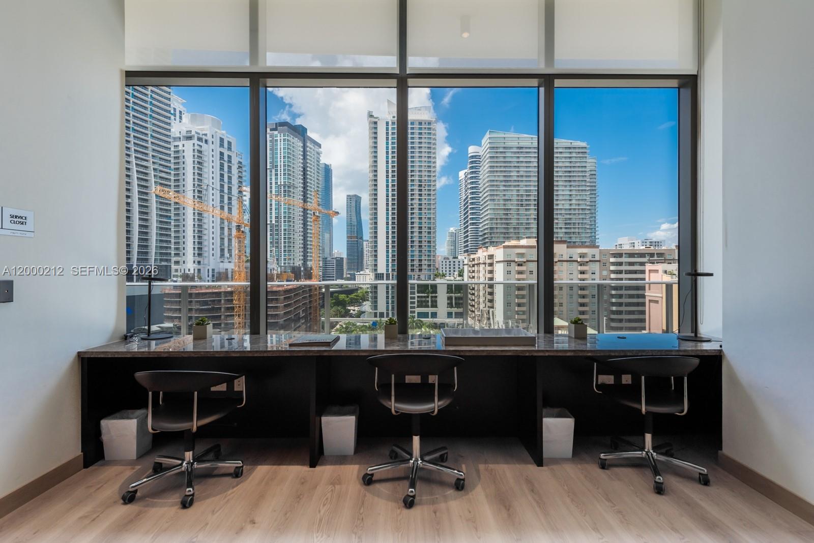 45 Southwest 9th Street, Unit 4006 Miami, FL 33130 - Photo 48 of 62 a view of a workspace with furniture and a window