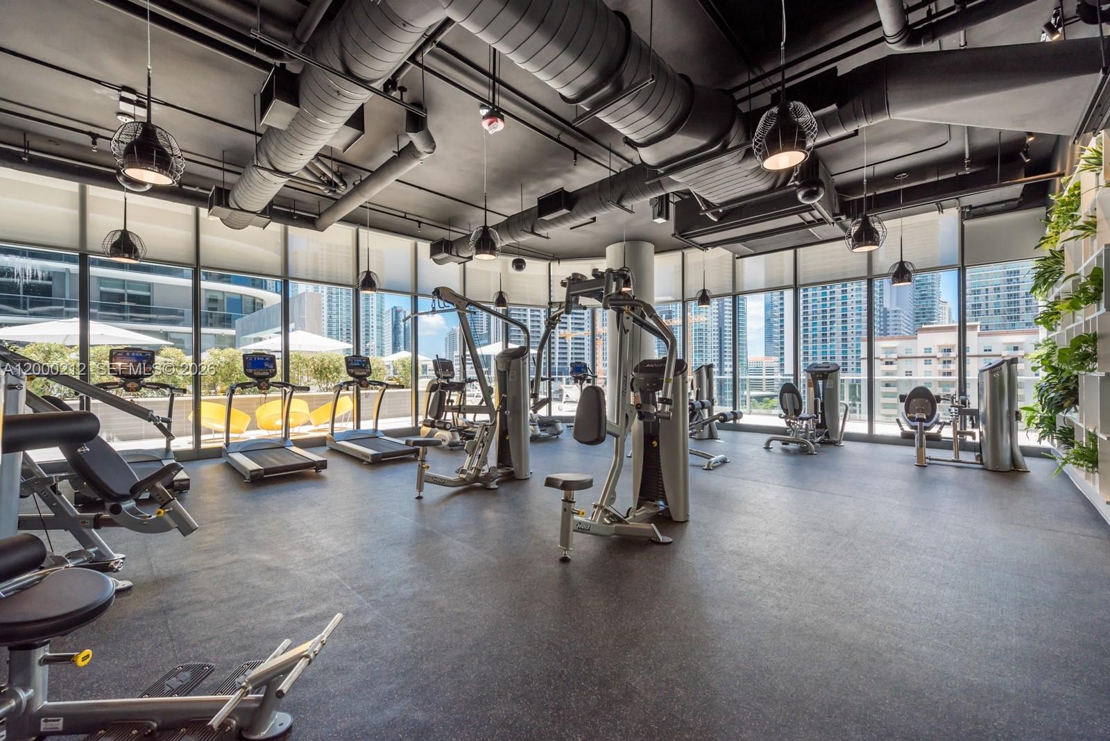 45 Southwest 9th Street, Unit 4006 Miami, FL 33130 - Photo 57 of 62 a view of a room with gym equipment