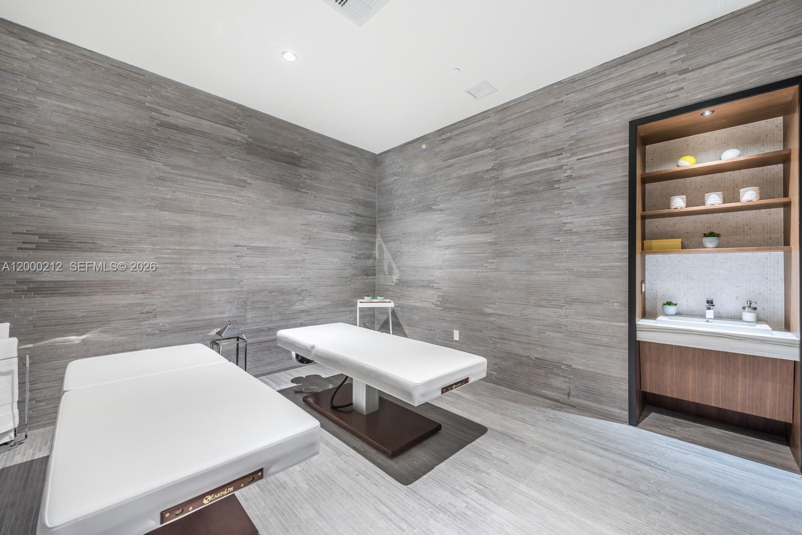 45 Southwest 9th Street, Unit 4006 Miami, FL 33130 - Photo 61 of 62 a bathroom with a toilet a sink and mirror