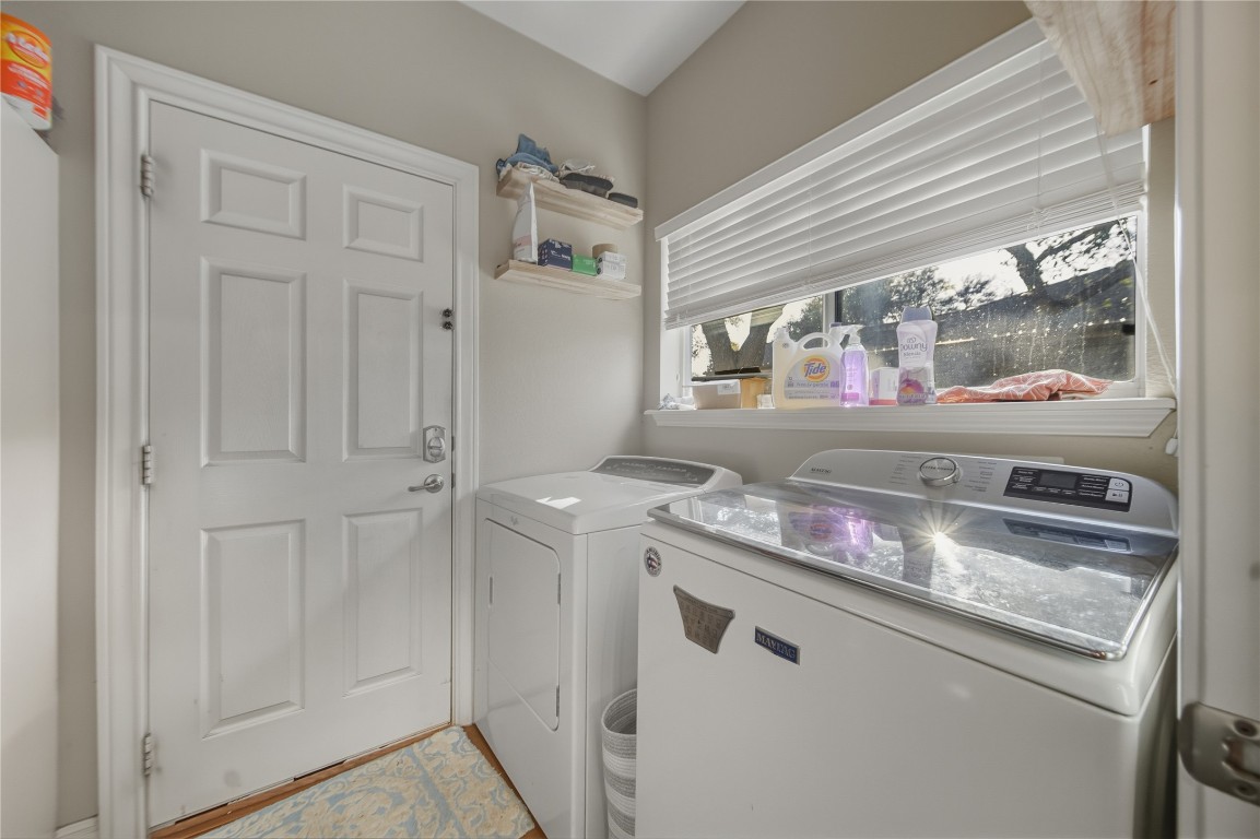 2207 Lauren Loop Leander, TX 78641 - Photo 10 of 26 a kitchen with granite countertop a sink and a stove