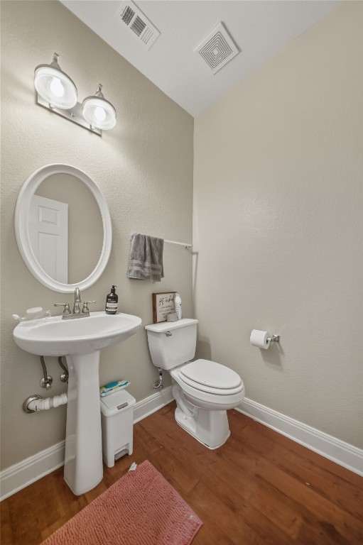 2207 Lauren Loop Leander, TX 78641 - Photo 11 of 26 a bathroom with a sink a toilet and a mirror