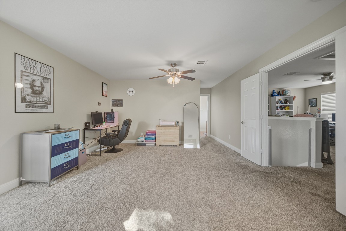 2207 Lauren Loop Leander, TX 78641 - Photo 14 of 26 a view of a livingroom with a workspace