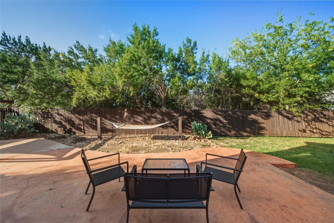 2207 Lauren Loop Leander, TX 78641 - Photo 21 of 26 a backyard of a house with table and chairs