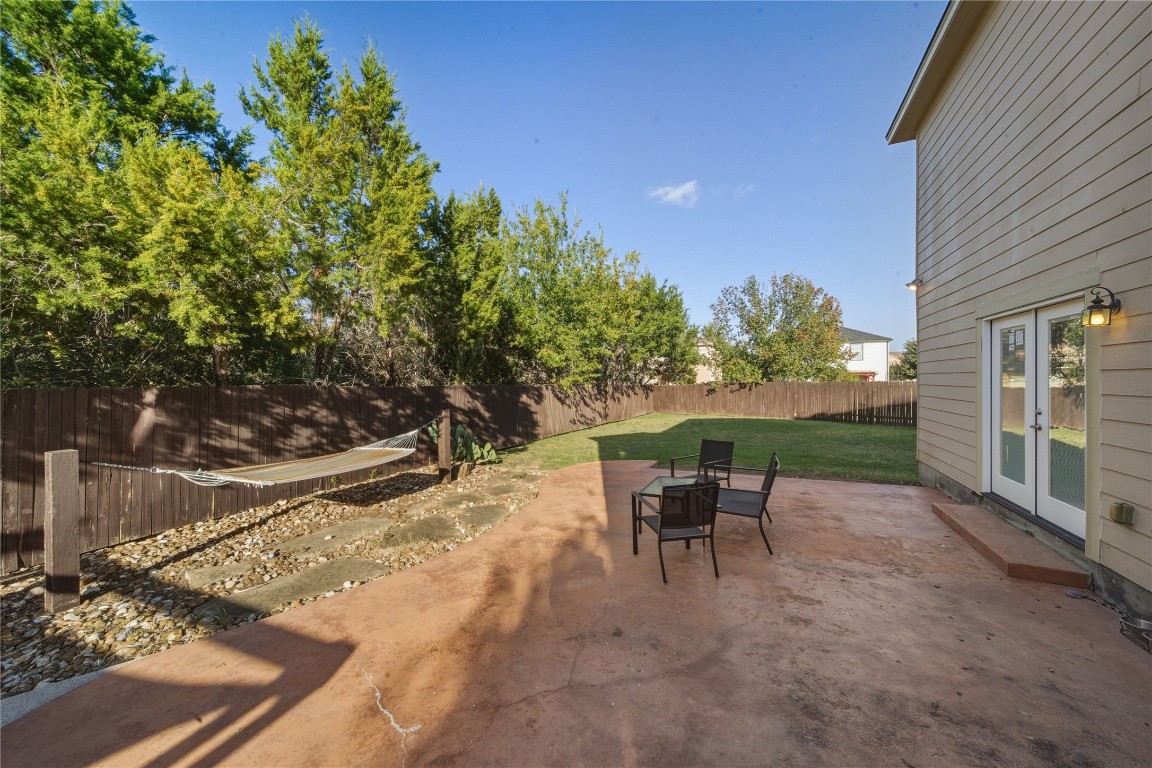 2207 Lauren Loop Leander, TX 78641 - Photo 22 of 26 a view of a backyard with sitting area