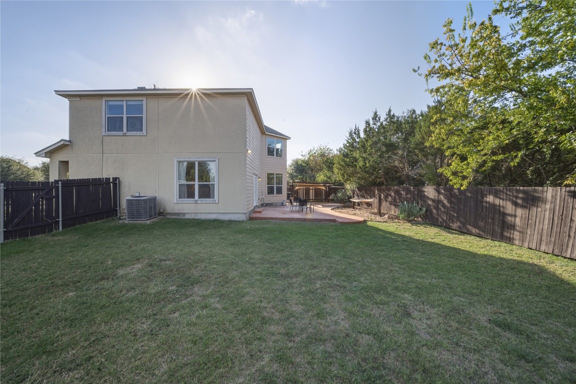 2207 Lauren Loop Leander, TX 78641 - Photo 23 of 26 a view of a house with backyard and garden