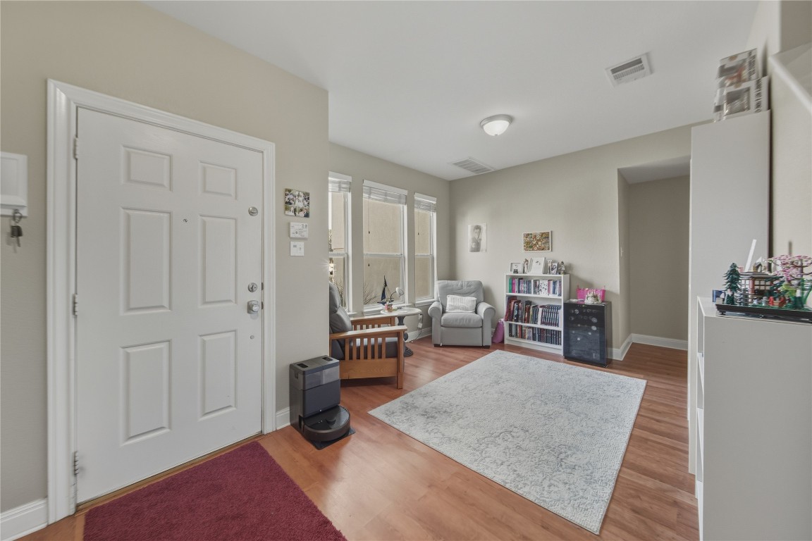 2207 Lauren Loop Leander, TX 78641 - Photo 4 of 26 a view of a livingroom with furniture and wooden floor