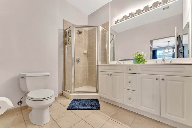 a bathroom with a shower toilet and sink